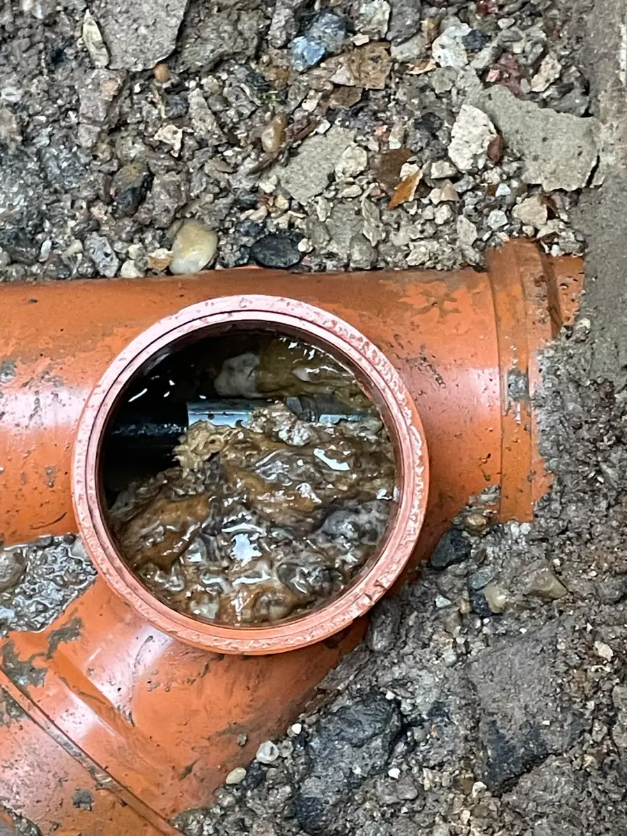 New plastic pipe junction in place in the ground